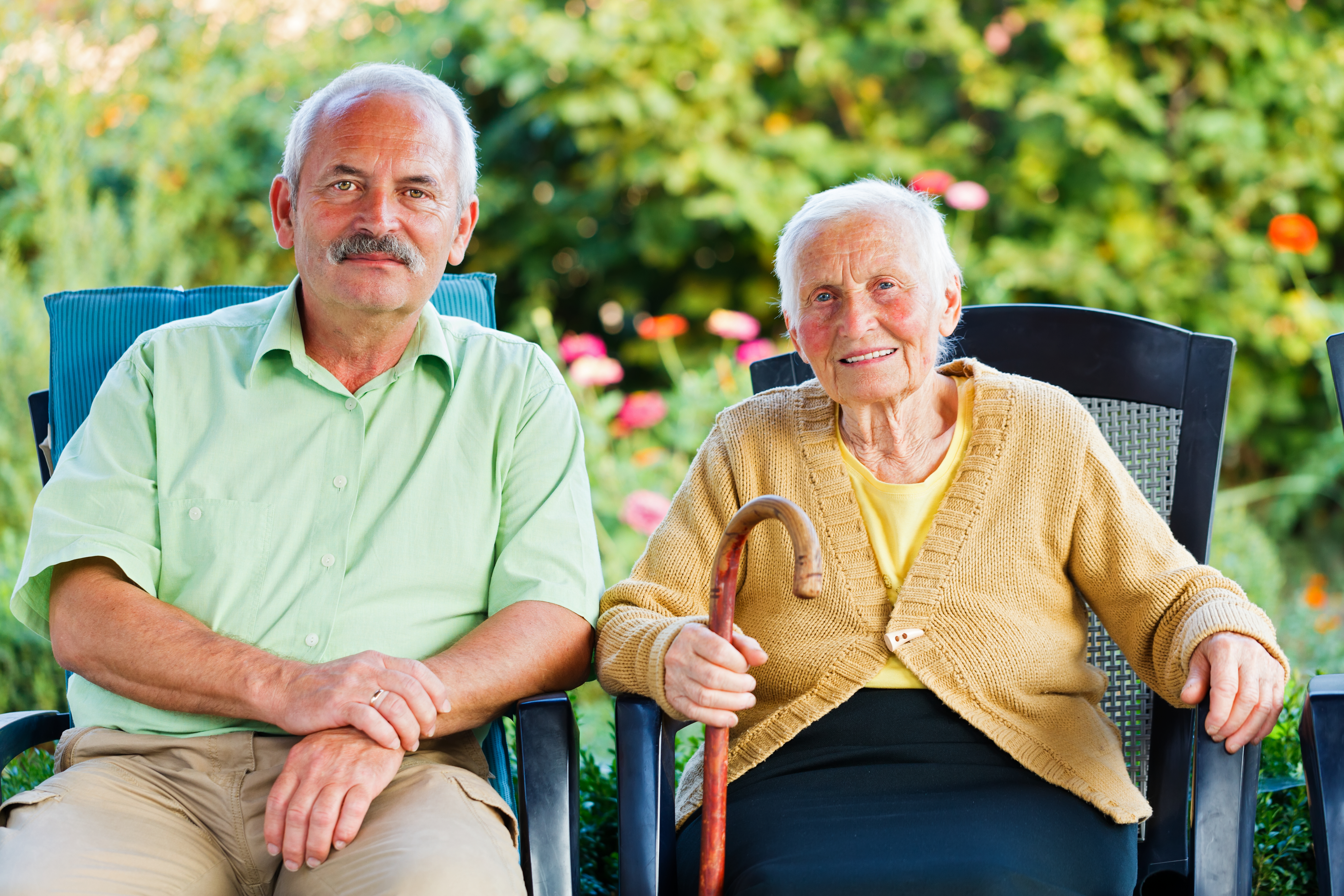 Man and older woman sitting together